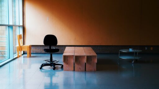 Business professionals collaborating around a table, discussing ethical considerations in a modern office setting.