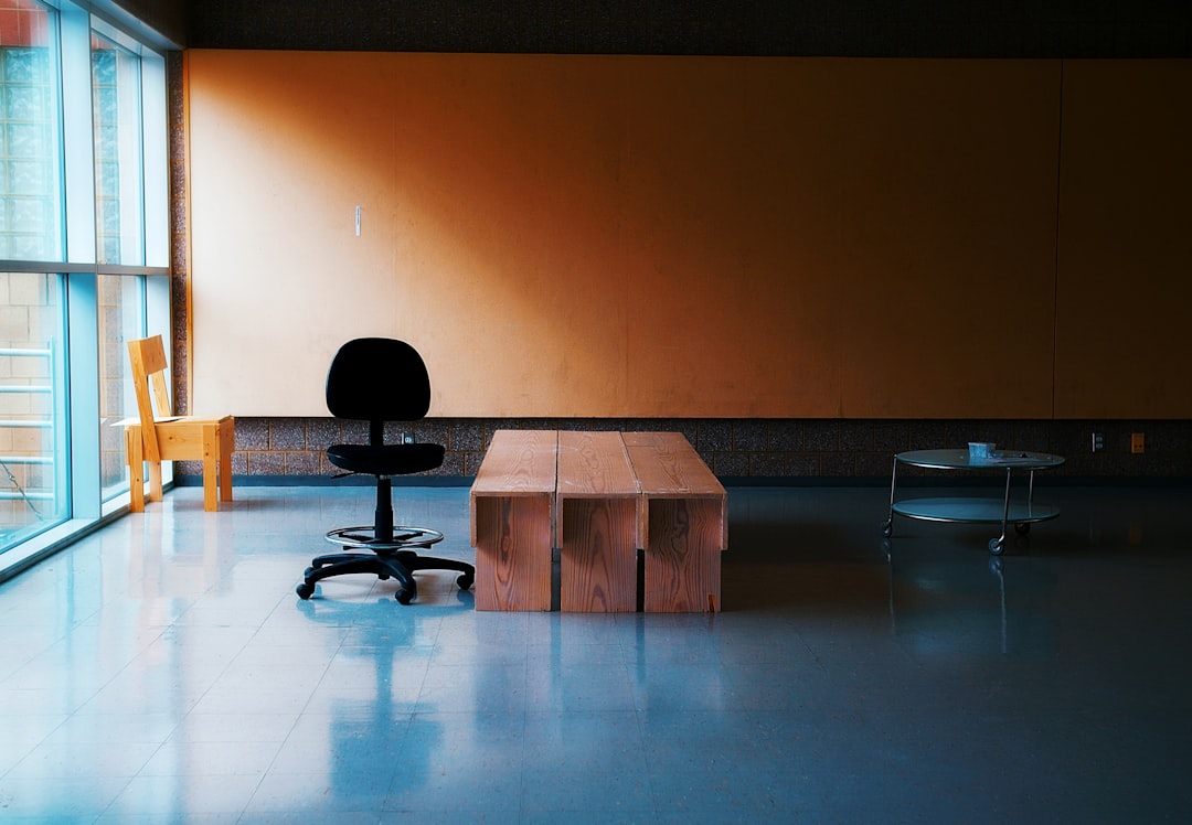 Business professionals collaborating around a table, discussing ethical considerations in a modern office setting.